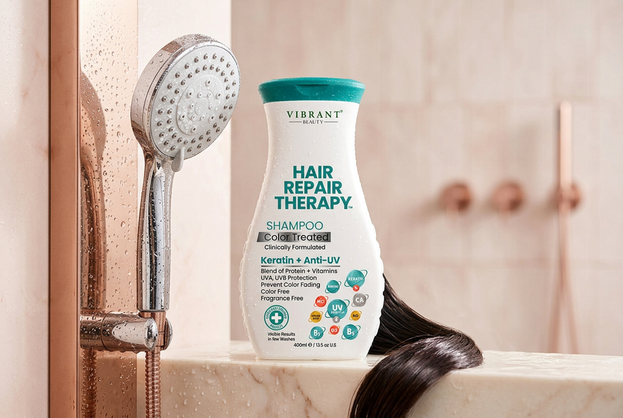 Vibrant Beauty Hair Repair Therapy shampoo by a shower head, a hard water hair care routine for damaged hair