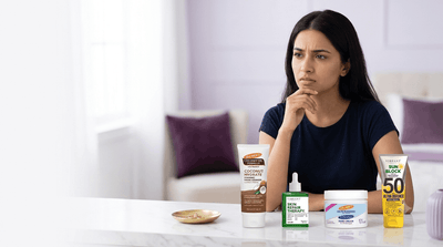 Woman following a daily skincare routine with cleanser, serum, moisturizer and sunscreen